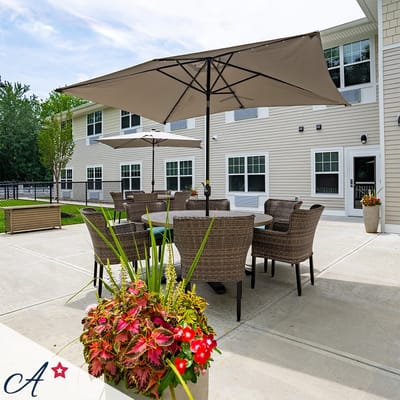 Outdoor patio area with seating and umbrellas
