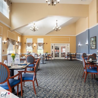 Bright dining room with tables and chairs