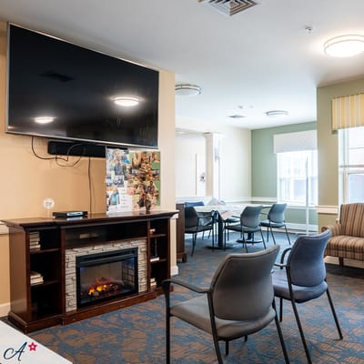 Common area with seating and a fireplace