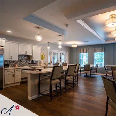 Bright common area with seating and kitchen space