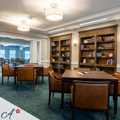 Cozy common area with bookshelves and seating