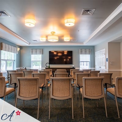 Activity room with chairs arranged for a presentation
