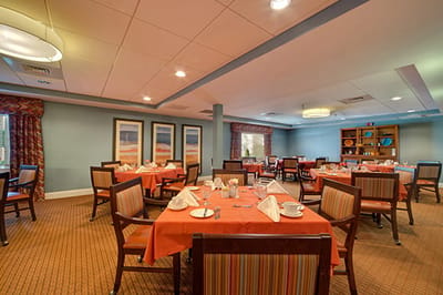 Dining room set for a meal in a warm atmosphere