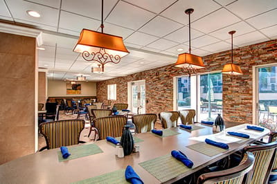 Well-lit dining room with decorative lighting