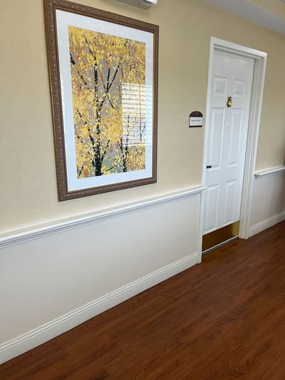 Interior hallway with art and door
