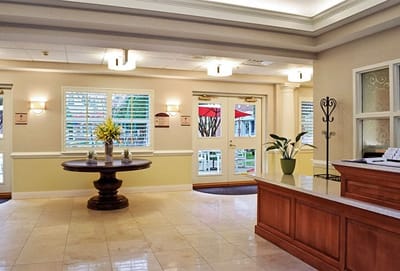 Bright lobby area with reception desk and seating
