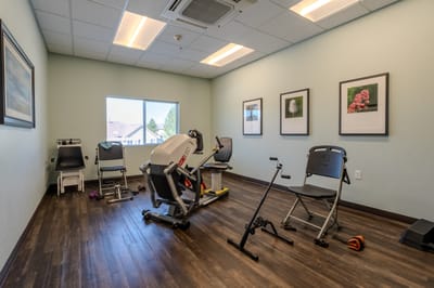 Exercise equipment in a well-lit activity room