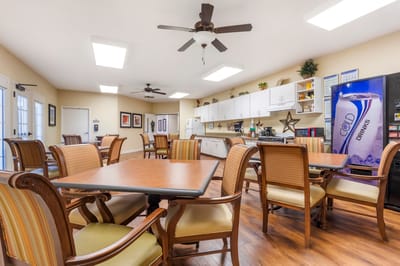 Interior view of a dining room with tables and chairs