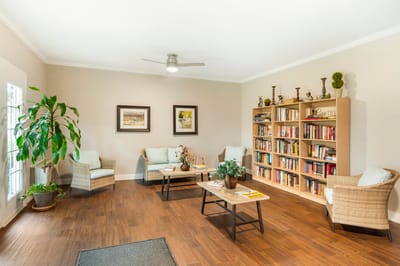 Cozy common area with bookshelves and seating