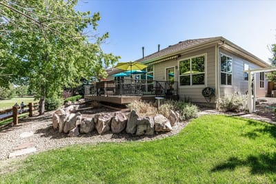 Outdoor patio area with seating and landscaping