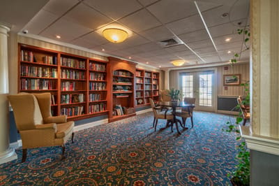 Cozy interior library with bookshelves and seating