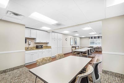 Bright common area with tables and chairs