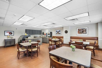 Dining room area with tables and flowers