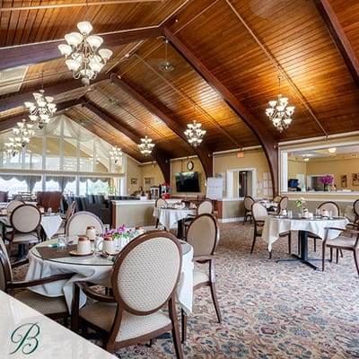Bright and inviting dining room area with tables set up
