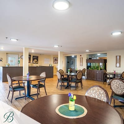Bright common area with dining tables and decor