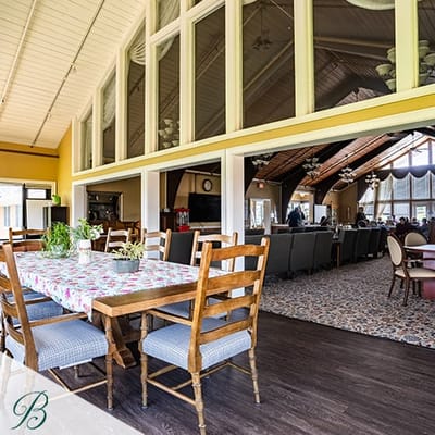 Interior view of the dining area with residents socializing
