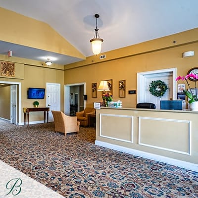 Interior view of the facility lobby with seating and a reception desk
