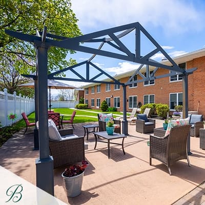 Outdoor seating area with pergola and chairs