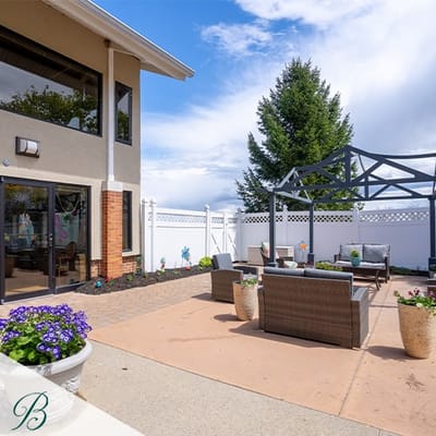 Outdoor seating area with planters and furniture