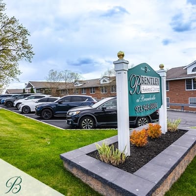 Exterior view of Bentley Assisted Living facility with signage