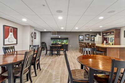 Interior view of a common area with wooden tables and chairs