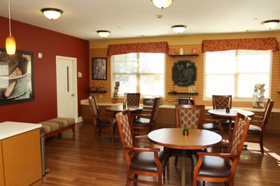 Dining area with chairs and tables in a cozy setting