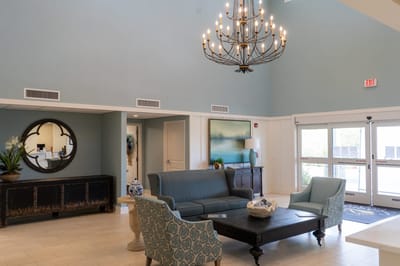 Elegant lobby area with seating and chandelier