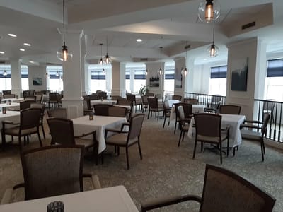 Dining area with tables and chairs in an interior space