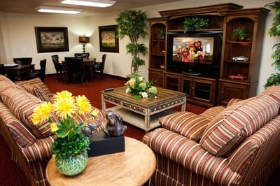 Interior common area with seating and a TV