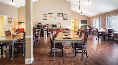 Bright dining area with tables and chairs