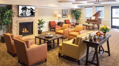 Cozy common area with chairs and fireplace