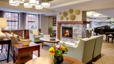 Cozy lounge area with seating and a fireplace
