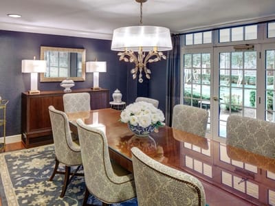 Bright dining room with elegant decor and floral centerpiece
