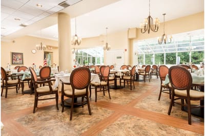 Bright dining room with well-arranged tables and chairs