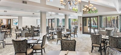 Bright dining room with tables set for meals