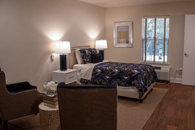 Cozy resident room with bed and seating area
