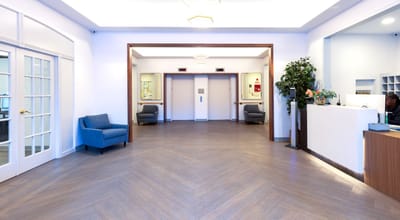 Interior lobby area with elevator and seating