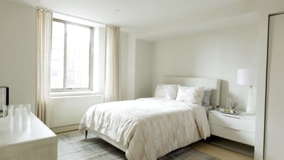 Bright, modern private resident room with bed