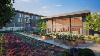 Outdoor view of a modern assisted living facility with gardens