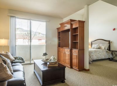 Bright interior view of a resident room with furniture
