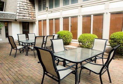 Outdoor seating area with tables and chairs