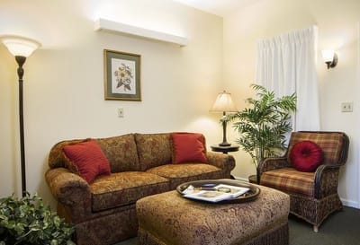 Cozy interior seating area with a sofa and lamp