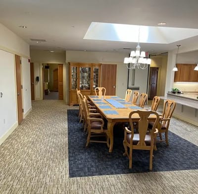Bright dining room with a long wooden table