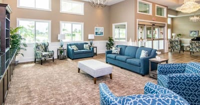 Bright common area with comfortable seating and natural light