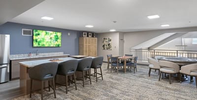 Common area with seating and a kitchen space