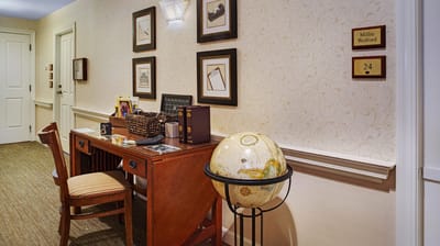 Cozy interior hallway with desk and globe decoration