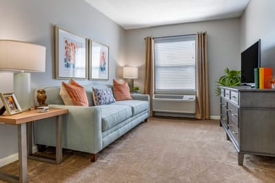 Cozy interior of a resident's room with a sofa and decor