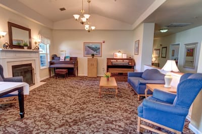 Comfortable common area with seating and piano
