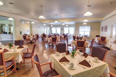 Dining room with tables set for meals