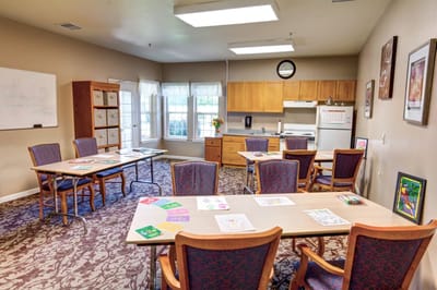 Activity room with tables and art supplies